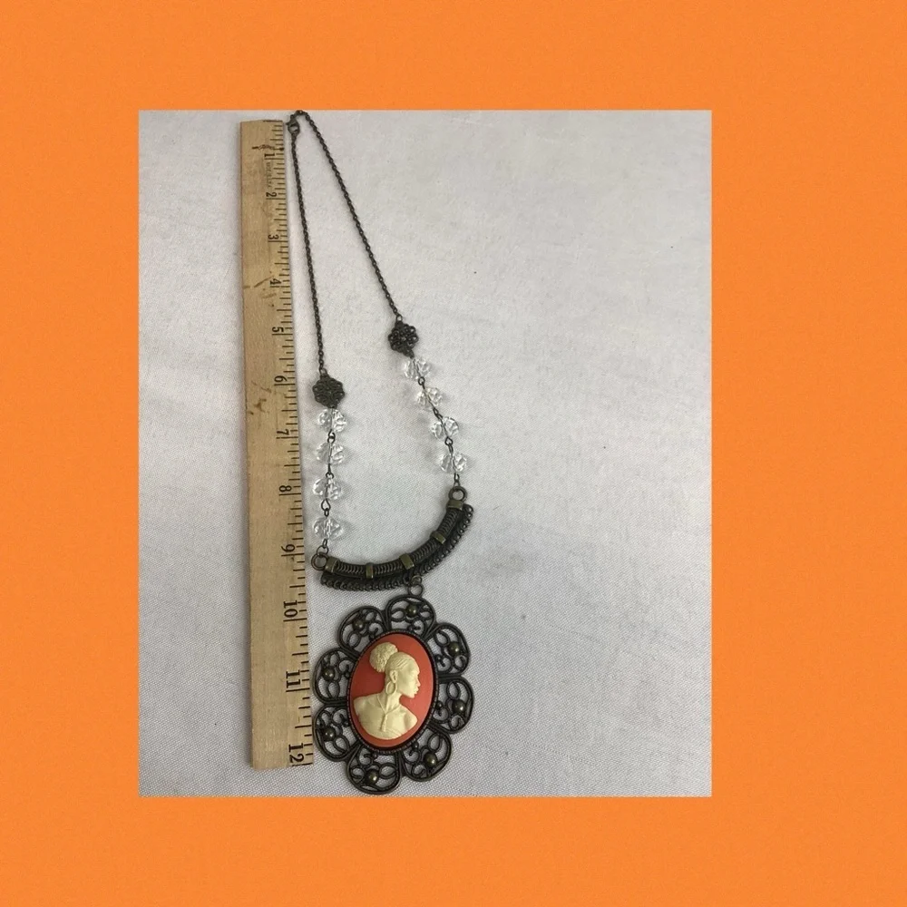Orange and bronze cameo necklace.